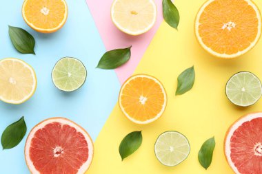 Narenciye renkli arka plan üzerinde yeşil yaprakları ile