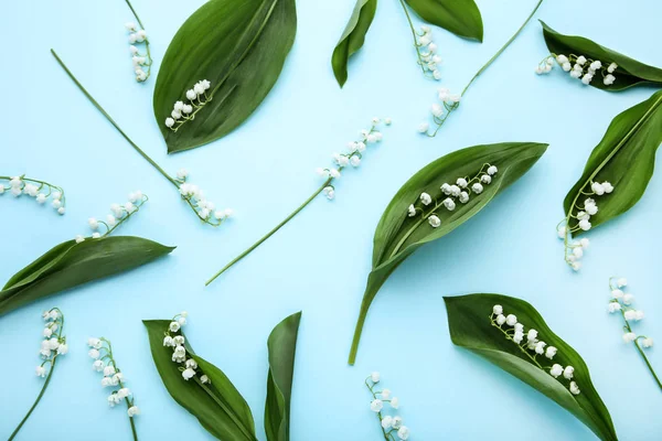 Lily of the valley flowers on blue background