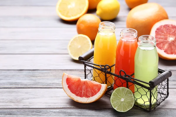 Citrus Juice Glass Bottles Fruits Wooden Table — Stock Photo, Image