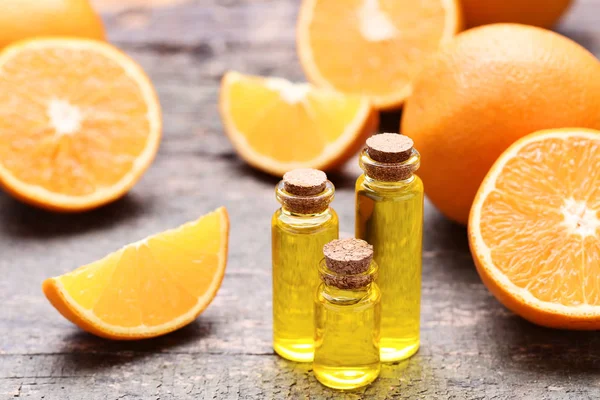 Aceite Naranja Botellas Sobre Mesa Madera Gris —  Fotos de Stock