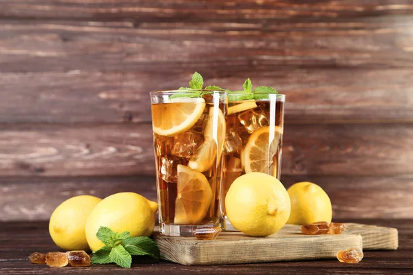 https://st4.depositphotos.com/4278641/22823/i/450/depositphotos_228237424-stock-photo-ice-tea-glasses-lemon-mint.jpg