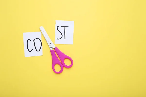 Paper Word Cost Scissors Yellow Background — Stock Photo, Image