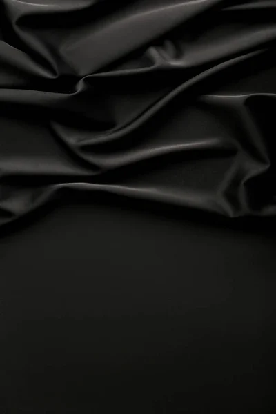 Background of ripple black satin fabric