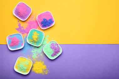 Colorful holi powder in bowls clipart