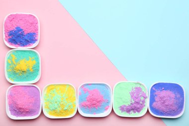 Colorful holi powder in bowls clipart