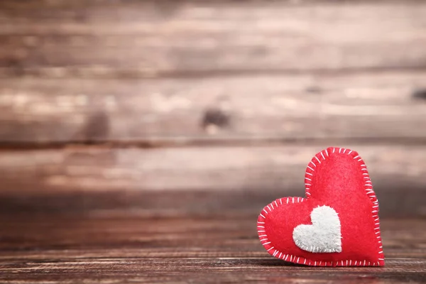 Red Fabric Heart Brown Wooden Table — Stock Photo, Image