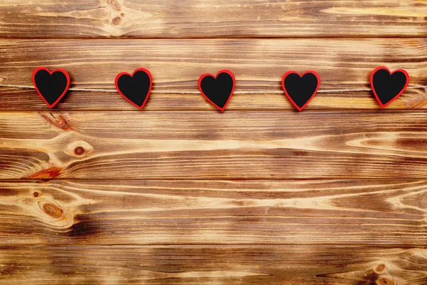 Small Hearts Hanging Brown Wooden Background — Stock Photo, Image