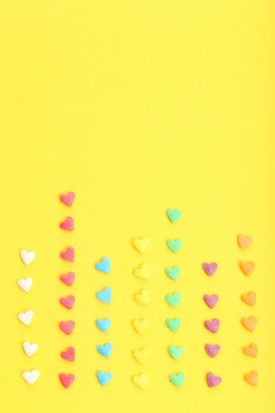 Colorful Heart Shaped Sprinkles Row Yellow Background — Stock Photo, Image