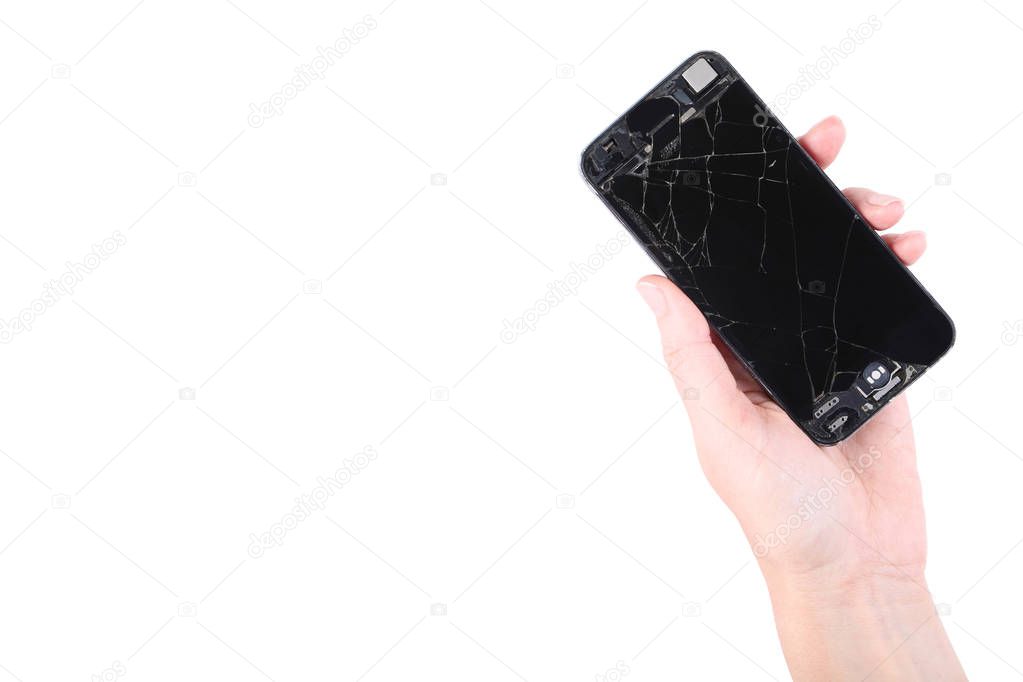 Broken smartphone in female hand on white background