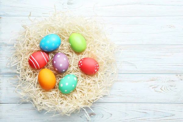 Colorful Easter Eggs Nest Wooden Table — Stock Photo, Image