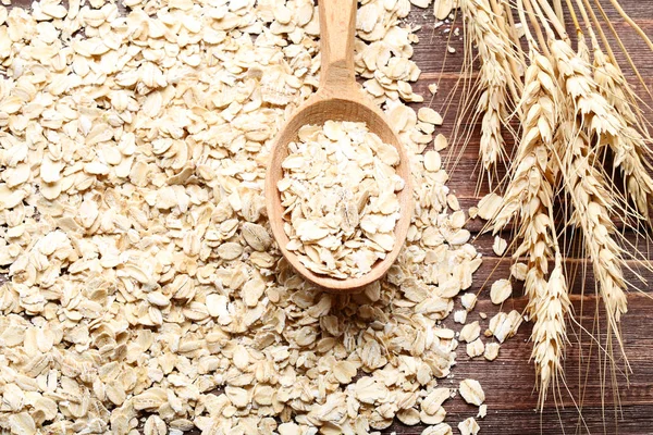 Haferflocken Mit Löffel Auf Holztisch — Stockfoto