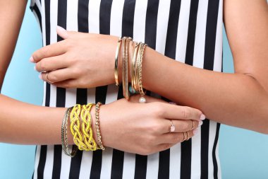 Female hands with bracelets and rings clipart