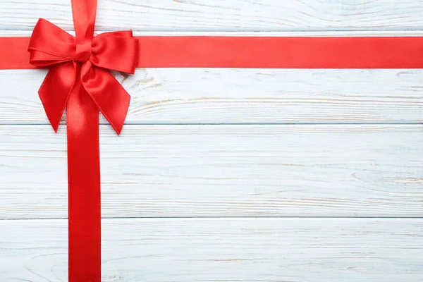 Red Bow Ribbon Wooden Table — Stock Photo, Image