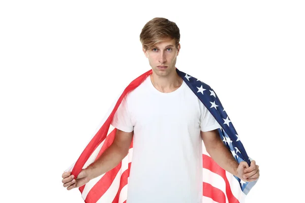 白い背景にアメリカの国旗を保持している美しい若い男 — ストック写真