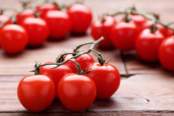 Cherry tomatoes on brown wooden table