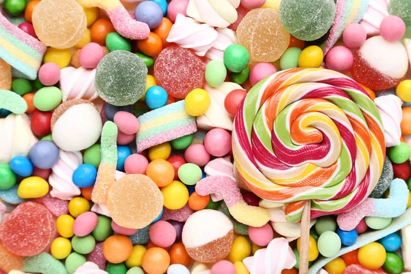 Fondo de caramelos dulces y piruletas — Foto de Stock