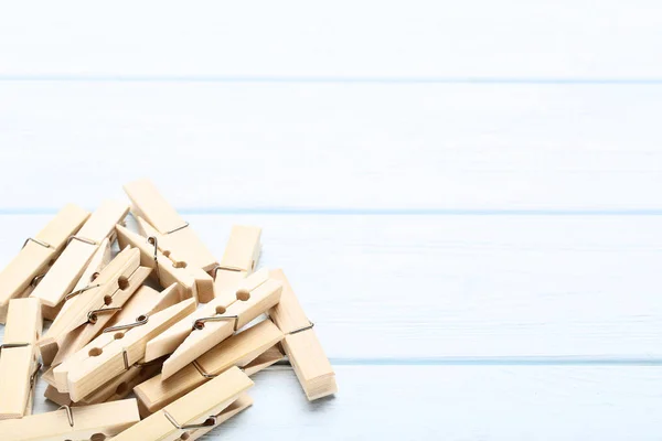 Brown clothespins on wooden table — Stock Photo, Image