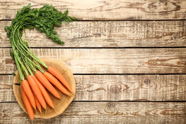 Fresh and sweet carrot on wooden background — Stock Photo, Image