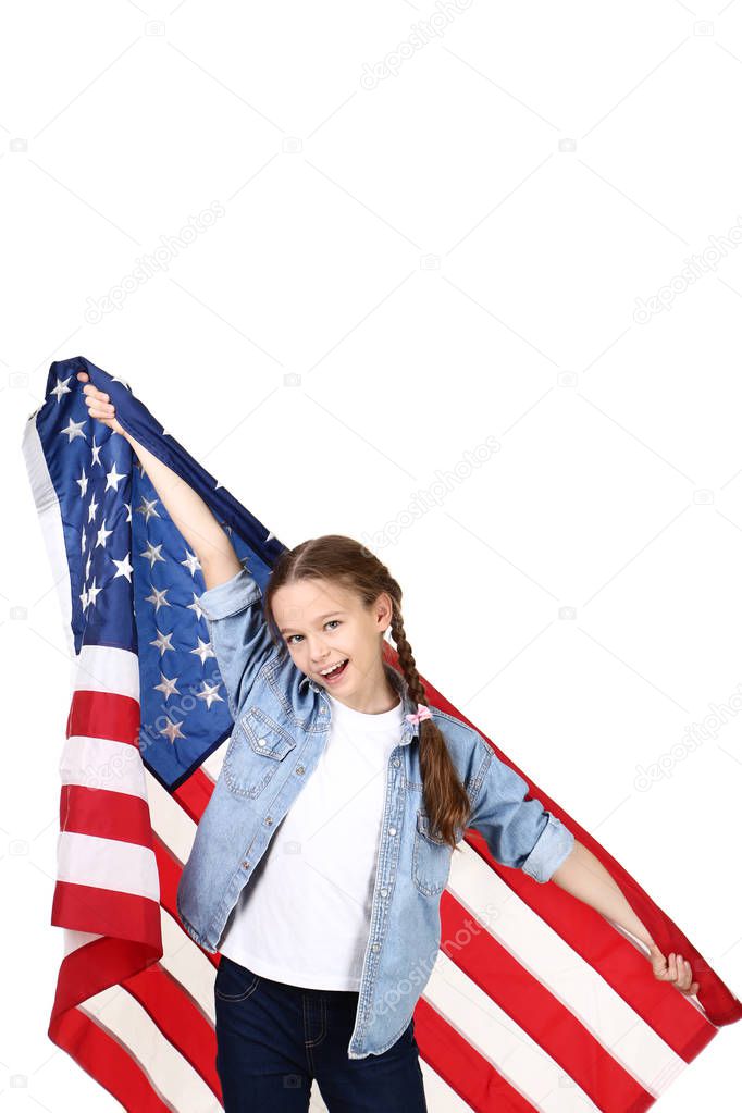 Young girl holding an American flag on white background