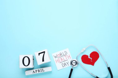 Metin Dünya Sağlık günü mavi stetoskop ve küp takvim ile