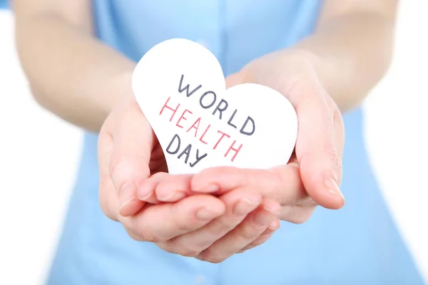 Papír-val szöveg egészségügyi világnap női kezek — Stock Fotó