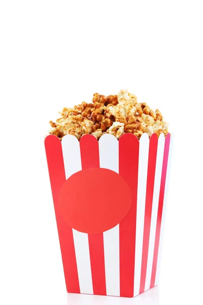 Caramel popcorn in striped bucket isolated on white background — Stock Photo, Image