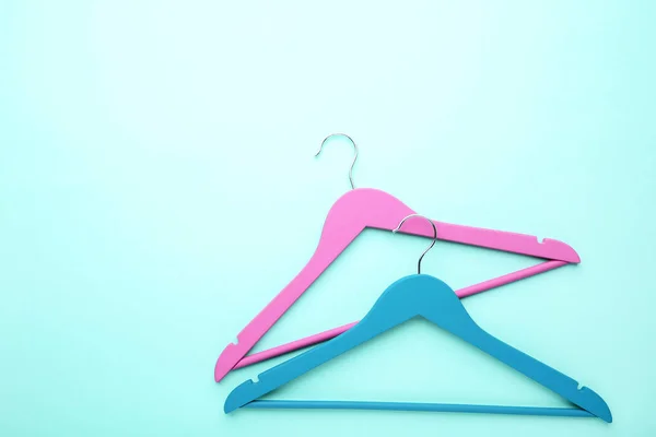 Colorful hangers on blue background