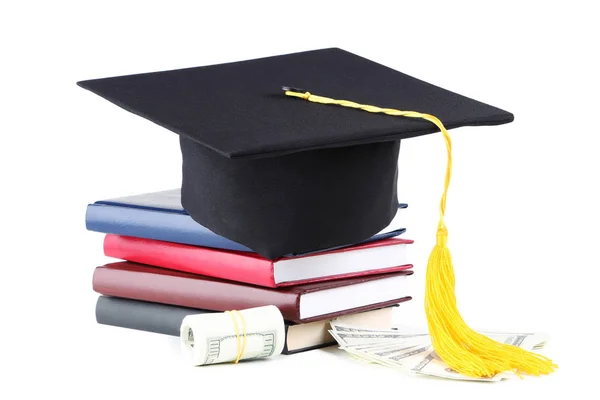 Graduation cap with stack of books and dollar banknotes isolated — Stock Photo, Image