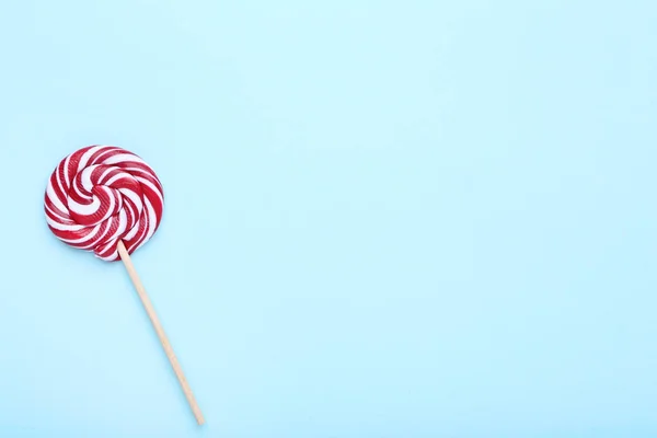 Colorful lollipop on blue background — Stock Photo, Image