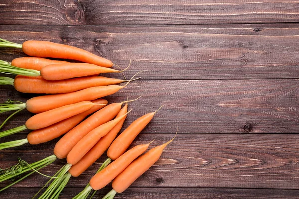 Fresh and sweet carrot on wooden background — Stock Photo, Image