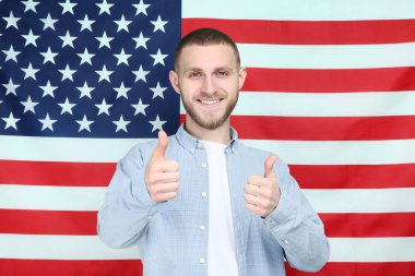 Young man on American flag background