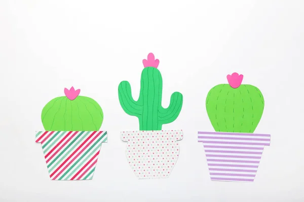 Paper cactuses on white background. Minimalism concept