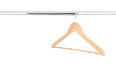 Wooden hanger hanging on white background