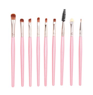 Beyaz arkaplanda pembe makyaj fırçaları izole