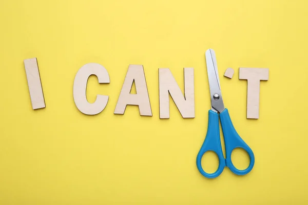 Text Can Scissors Yellow Background — Stock Photo, Image