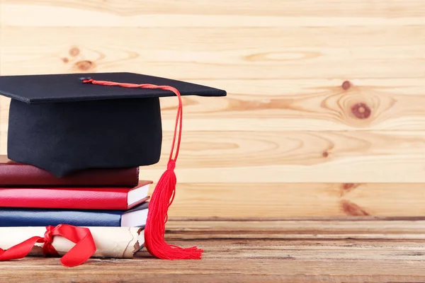 Graduation Cap Diploma Stack Books Brown Wooden Table — Stock Photo, Image