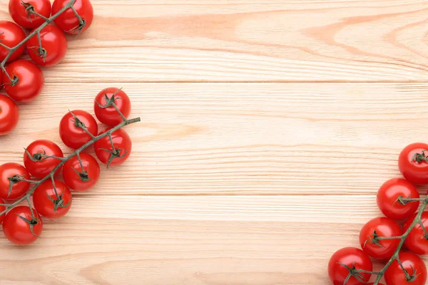 Cherry tomatoes on brown wooden table