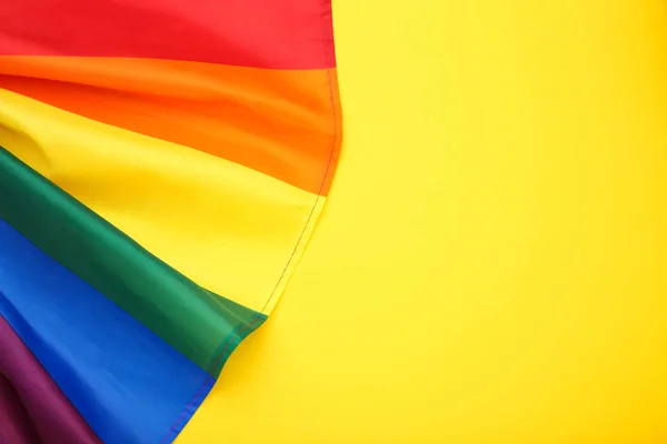 Rainbow flag on yellow background — Stock Photo, Image