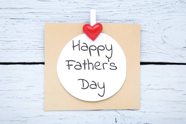 Text Happy Fathers Day with red heart on wooden table — Stock Photo, Image