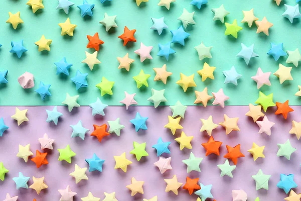Paper stars on colorful background