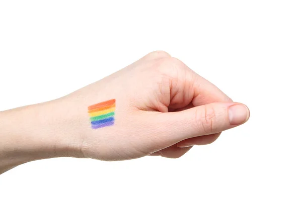 Mano femenina con dibujo de la bandera del arco iris y sobre fondo blanco — Foto de Stock