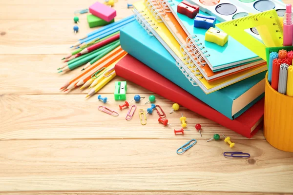 School supplies on brown wooden table — Stock Photo, Image