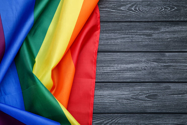 Rainbow flag on wooden table