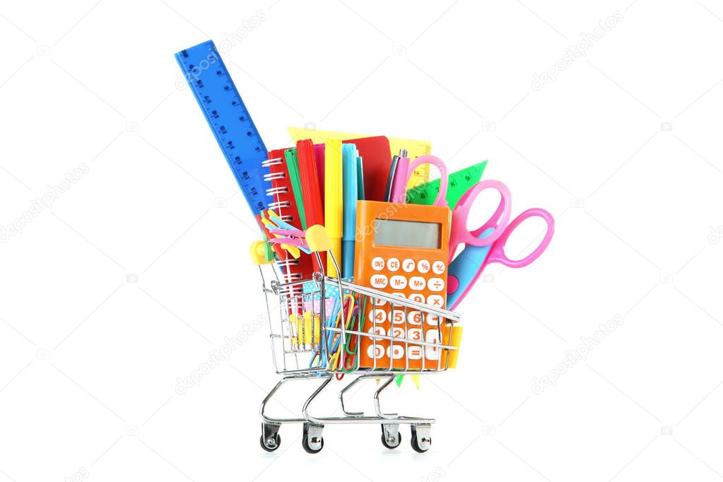 School supplies in shopping cart on white background