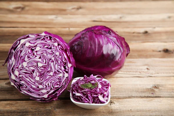 Fresh red cabbage on brown wooden table