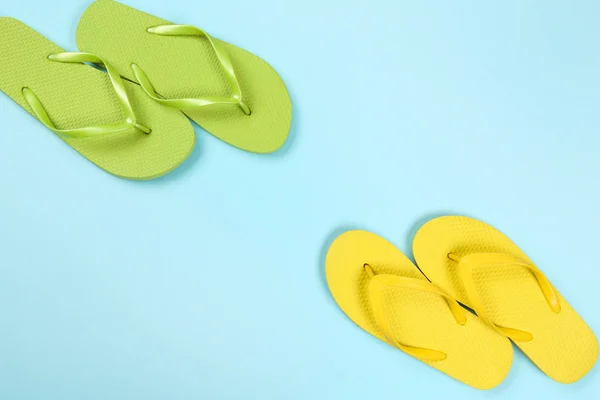 Pair of flip flops on blue background — Stock Photo, Image