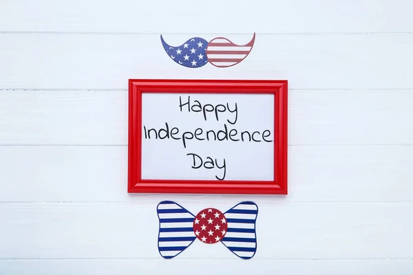 Text Happy Independence Day with paper bow tie and mustache on w