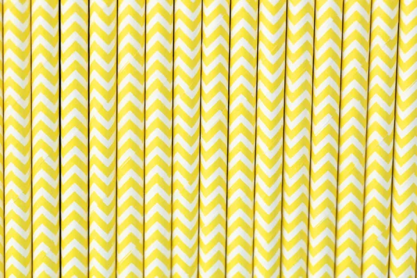 Background of yellow paper straws