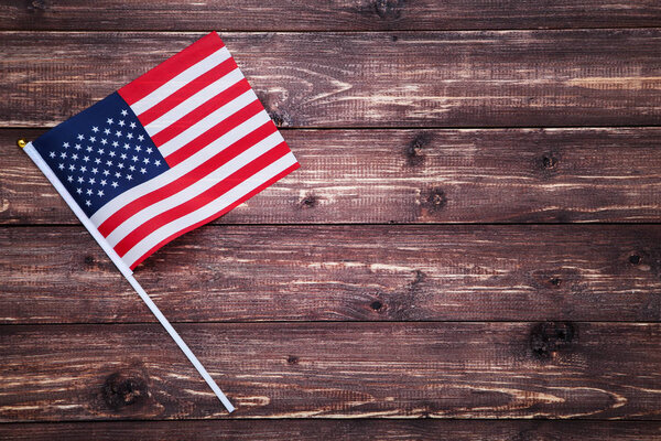 American flag on brown wooden table