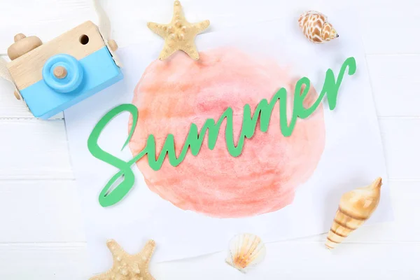 Word Summer with seashells and retro camera on white wooden tabl — ストック写真